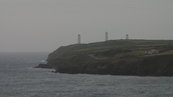 SX00270 Three White Towers and Metal Man Tramore.jpg